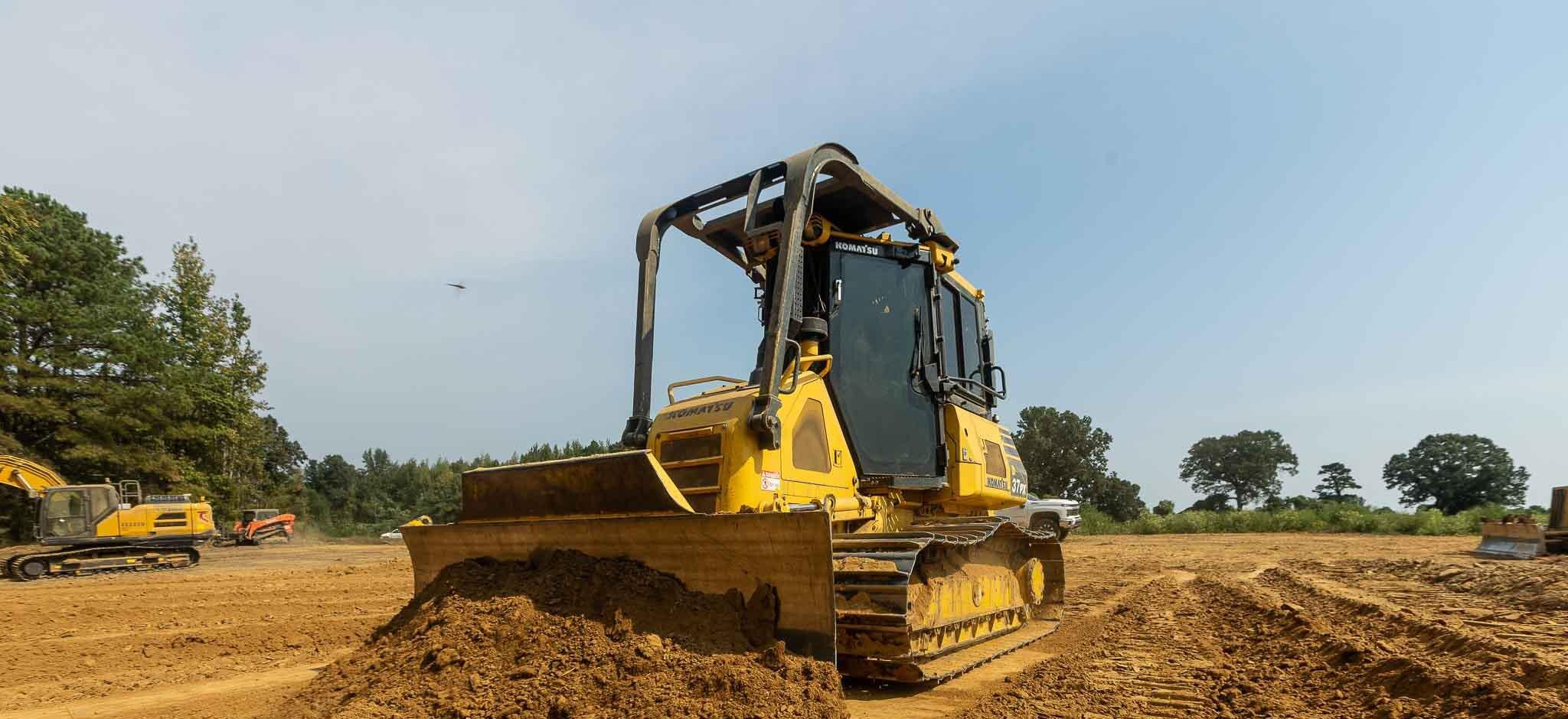 Bulldozer pushing grade on a prepared site